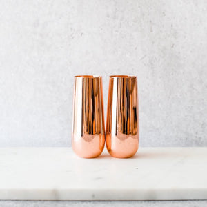 
                  
                    Load image into Gallery viewer, Unique gifts for special occasions are hard to find – we know, we’ve looked. Our copper champagne flutes make perfect keepsake gifts that give the blend of luxury and practicality you’ve been looking for. Imagine sipping bubbles from these chic flutes; they’re a gift to be treasured and we promise they’ll add sparkle to every celebration.  COPPER STEMLESS CHAMPAGNE FLUTES
                  
                